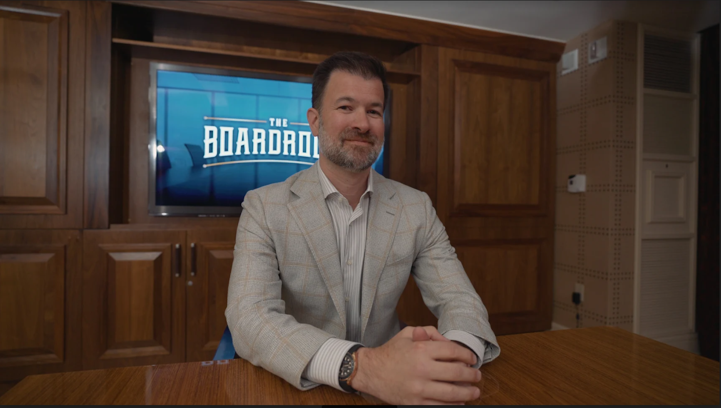 Jeff sitting at a boardroom table