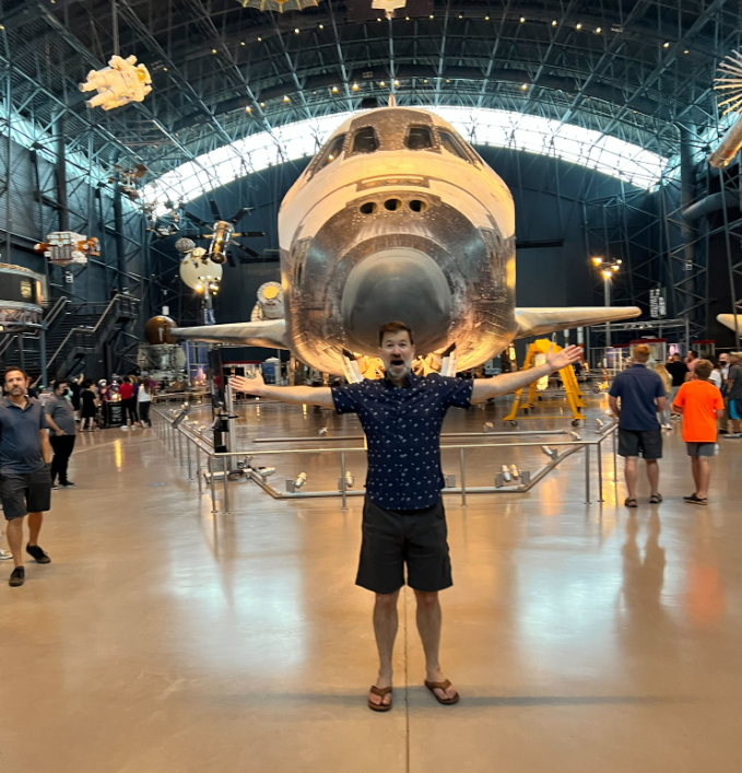JEFF IN FRONT OF A SPACE SHUTTLE