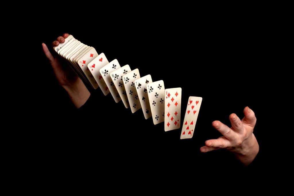 Two hands shuffling cards